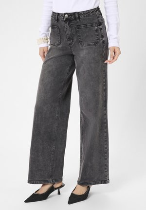 Džinsi ar paplatinātiem galiem - grey vintage wash