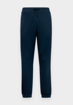 Tummansinisiä joggereita, jotka on valmistettu pehmeästä kankaasta. Niissä on elastinen vyötärö, kiristysnauha ja resorit nilkoissa, jotka takaavat mukavan istuvuuden. Taskuja ei ole näkyvissä.