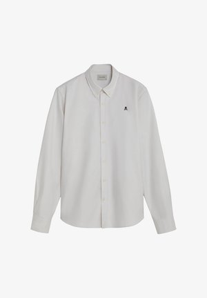 White long-sleeve button-up shirt with subtle vertical stripes and a small black skull and crossbones logo on the left chest.