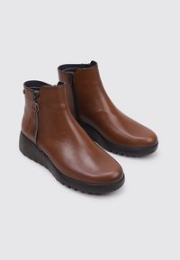 Fluchos Platform ankle boots - camel