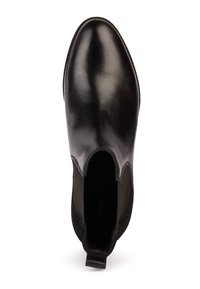Botte Chelsea en cuir noir poli avec panneaux latéraux élastiques et languette de traction au talon, vue de dessus sur fond blanc.