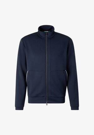 Mørkeblå fuld-lynlåset jakke med opretstående krave, lange ærmer, sidelommer med hvid kant og et diskret logo på venstre ærme.