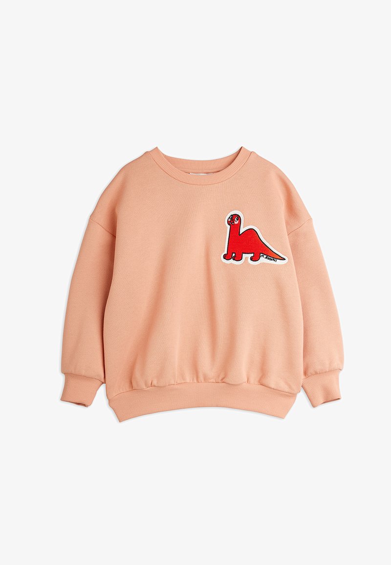 Sudadera de color durazno con puños y dobladillo acanalados. Presenta un bordado de dinosaurio rojo en el lado izquierdo del pecho. Fabricada con una tela suave y texturizada.