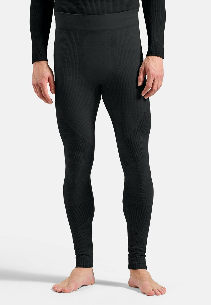 Black thermal leggings made of textured fabric with a fitted design, featuring a wide waistband and reinforced panels for support.