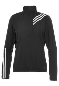 Pull-over de sport noir à manches longues avec un col montant, trois bandes blanches sur l'épaule gauche et l'avant-bras gauche, et un petit logo près de l'ourlet.