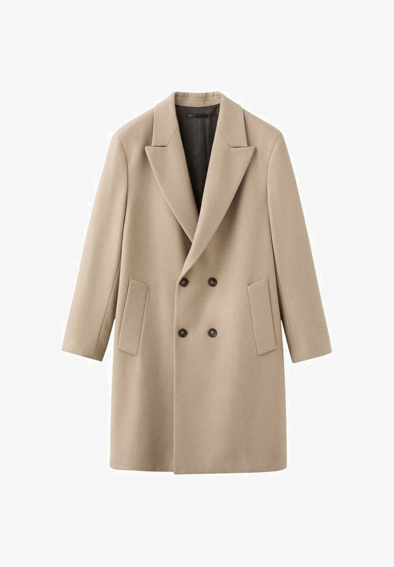 Beige dubbelzijdige jas met grote revers, twee voorkantzakken en zwarte binnenvoering. Gemaakt van een textuurstof met een gladde uitstraling.