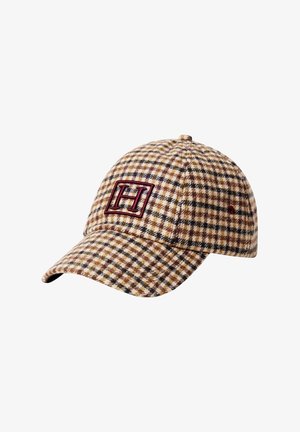 Baseball cap with brown and beige plaid pattern and a red embroidered "H" inside a square on the front panel.