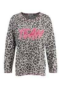 Leopard print sweatshirt with long sleeves, rounded neckline, pink "YEAH" text, and contrasting pink trim along the neckline and hem.