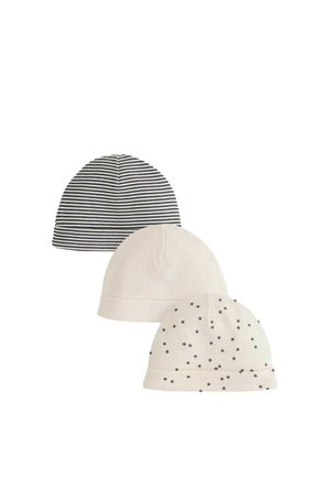 Tre bløde strikkede babyhuer: én sort og hvid stribet, én ensfarvet creme og én creme med små sorte stjerner.