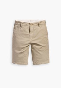Beige Chino-Shorts aus Baumwolle, mit Reißverschluss, Knopfverschluss, Gürtel-Schlaufen und Seitentaschen, mit einer glatten Textur und einer taillierten Passform.