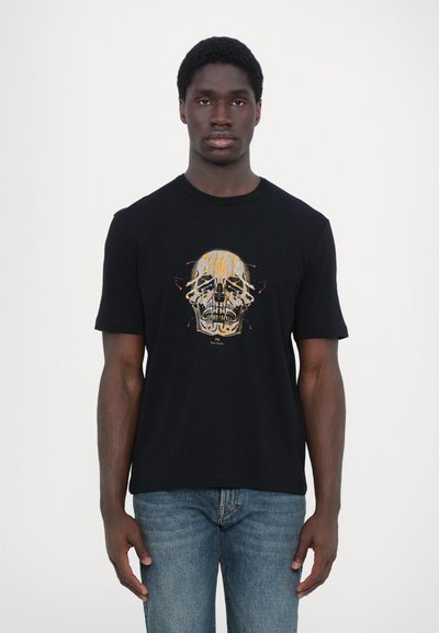 Schwarzes Baumwoll-T-Shirt mit einem bunten Totenschädel-Motiv auf der Vorderseite. Kurze Ärmel und ein Rundhalsausschnitt, mit einer lockeren Passform.