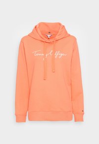 Felpa con cappuccio color corallo dal fit rilassato, dotata di logo frontale bianco, collo con cordoncino e polsini e orlo a costine.