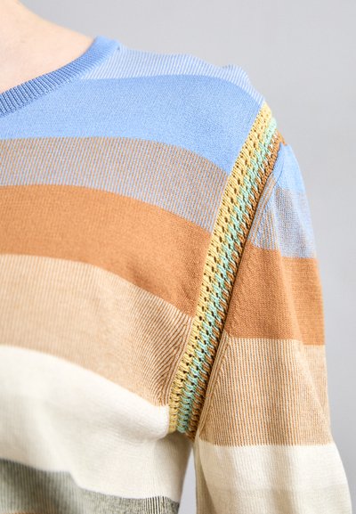 Striped sweater in blue, brown, and cream with a textured yarn detail on the shoulder. Features a round neck and ribbed hem.