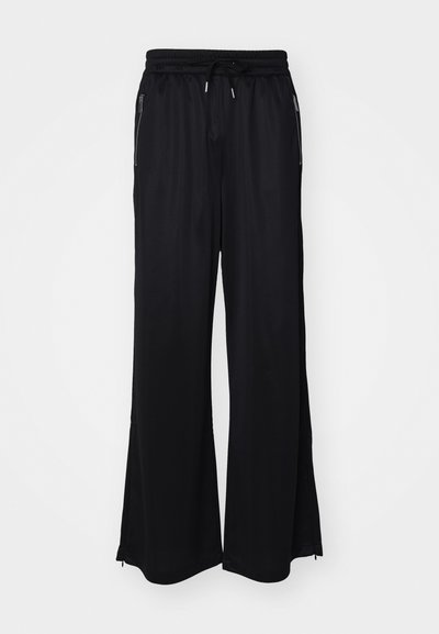 Han Kjøbenhavn OVERSIZED TRACK UNISEX - Calças de fato de treino - black