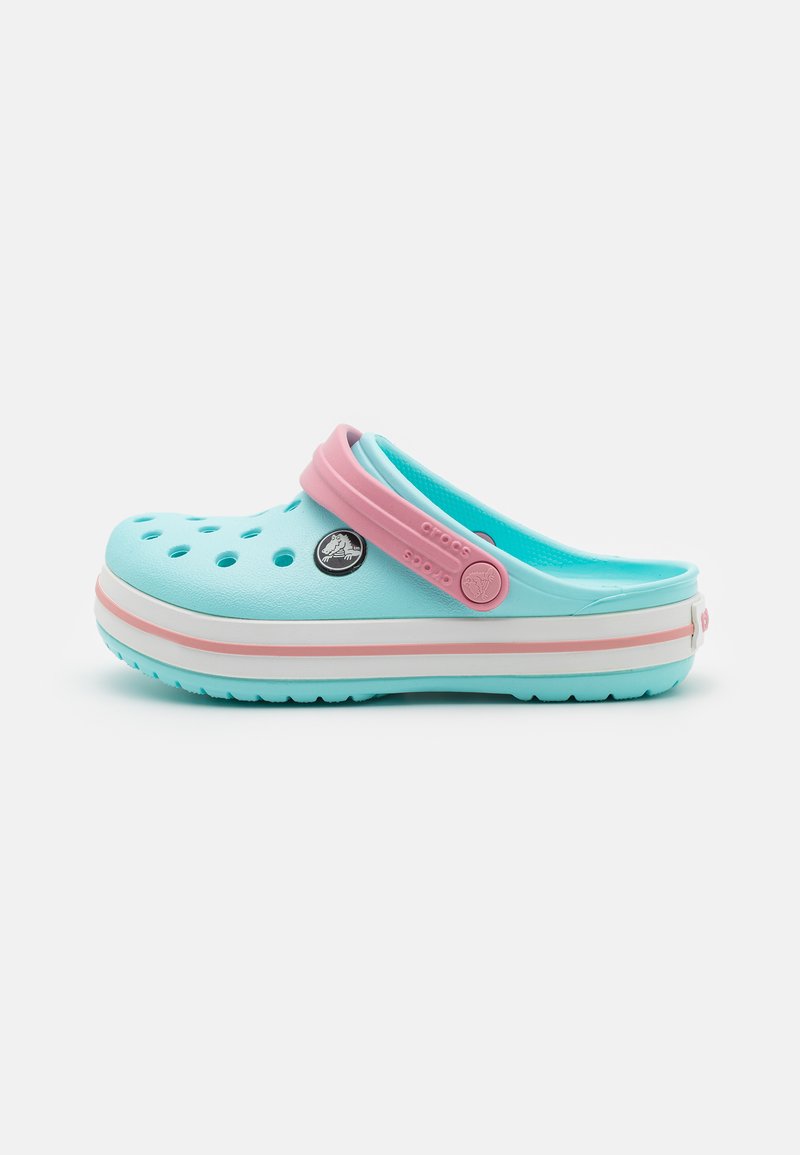 Light blue clog with pink accents, ventilated holes, a back strap, and a white midsole with pink and light blue stripes.