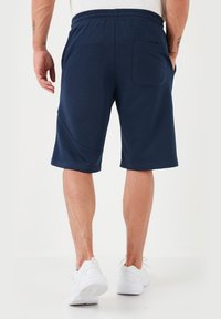 Buratti REGULAR FIT - Verryttelyhousut - indigo