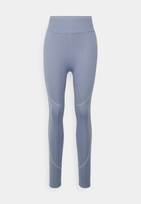 Růžové legíny s vysokým pasem ve světlemodré barvě, vyrobené z pružného materiálu, mají zakřivené švy a ploché švy pro hladký vzhled.