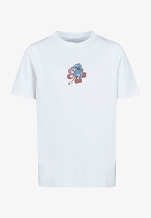 Tricou alb din bumbac cu un personaj de desene animate albastru așezat pe un desen cu floare roșie, guler rotund și mâneci scurte.
