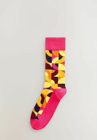 Multifarvet sok med en lyserød ribkant, geometriske mønstre i gul, orange, kastanjebrun og mørkeblå. Materiale af bomuldsblanding.