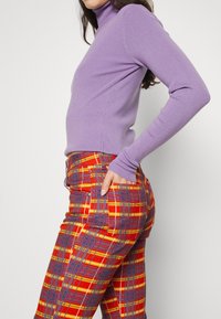 The Ragged Priest Jean flare - multi-coloured
