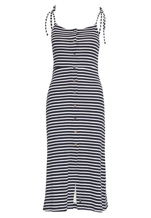 Czarna i biała sukienka midi w poziome paski, z guzikami z przodu i wiązanymi ramiączkami na ramionach.