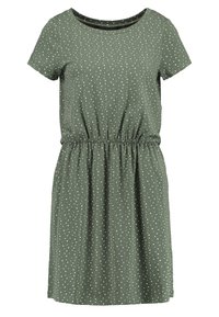 Robe à manches courtes, longueur genoux, de couleur vert olive avec des pois blancs, dotée d'une taille élastique et d'un col rond.