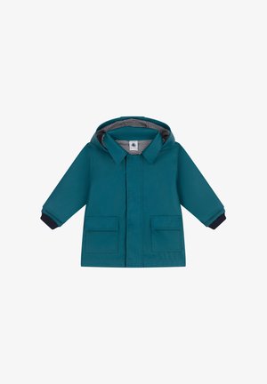 Teal waterdichte jas met capuchon, met een gestreepte binnenkant, sluiting met knopen aan de voorkant en twee grote zakken aan de voorkant. Marineblauwe accenten bij de manchetten.