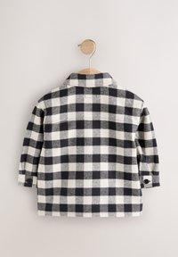 Kariertes Flanellhemd in Schwarz und Weiß. Verfügt über einen Kragen, lange Ärmel und Knopfverschluss an den Manschetten. Strukturierter Stoff mit Karomuster.