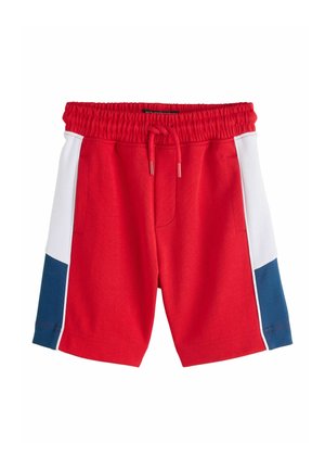 Red athletic shorts with elastic waistband and drawstring, featuring white and navy side panels and front pockets.