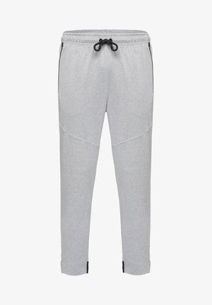 Hellgraue Sweatpants mit einem Kordelzugbund, seitlichen Taschen und schwarzen Akzenten an den Knöcheln; aus weichem, strukturiertem Stoff.