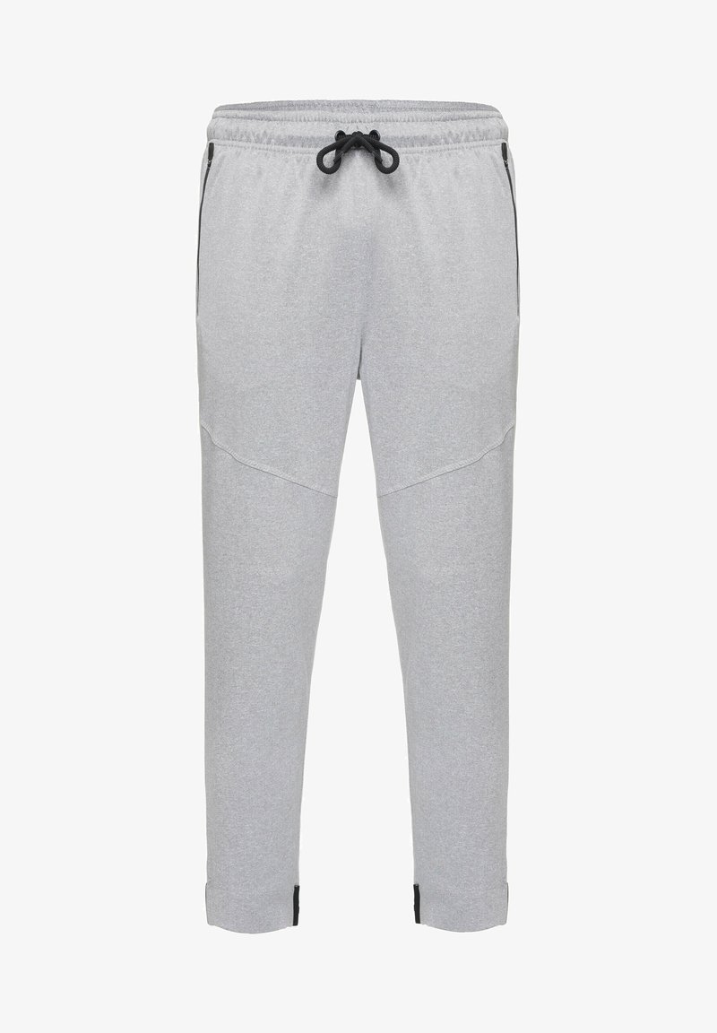 Lichtgrijze sweatpants met een verstelbare tailleband, zijzakken en zwarte accenten bij de enkels; gemaakt van zachte, gestructureerde stof.