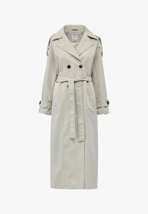 Beżowy płaszcz trench z lekkiego materiału. Posiada podwójnie zapięte guziki, pasek w talii oraz mankiety z guzikami. Płaski fason kołnierza.