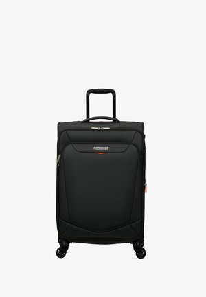 Black spinner suitcase with a textured exterior, retractable handle, dual wheels, and orange zipper accents. Features branded logo on front.