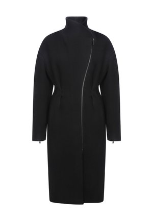 Manteau en laine noire avec un col montant, fermeture éclair frontale asymétrique et manches longues. Présente une silhouette ajustée et un design minimaliste.
