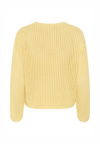 Suéter amarillo de punto con un corte holgado, mangas anchas y un patrón texturizado con tejido abierto. La vista trasera muestra un dobladillo acanalado a la altura de la cintura.