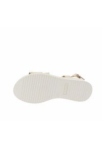 Sandale beige clair avec deux larges brides, une semelle blanche texturée et un design minimaliste. Présente de petites décorations sur les brides.