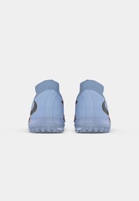 Light blue athletic shoes with a high ankle collar, textured material, red accents, and a gray logo on the heel. Clear rubber sole.
