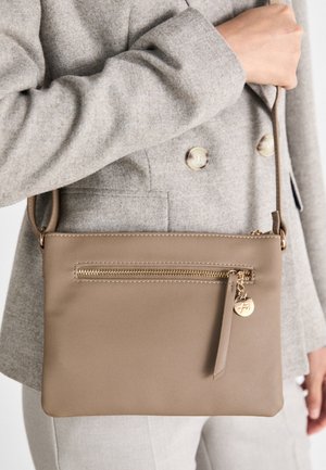 Beige leather crossbody bag with a rectangular shape, featuring a front zipper pocket and gold-tone hardware accents.