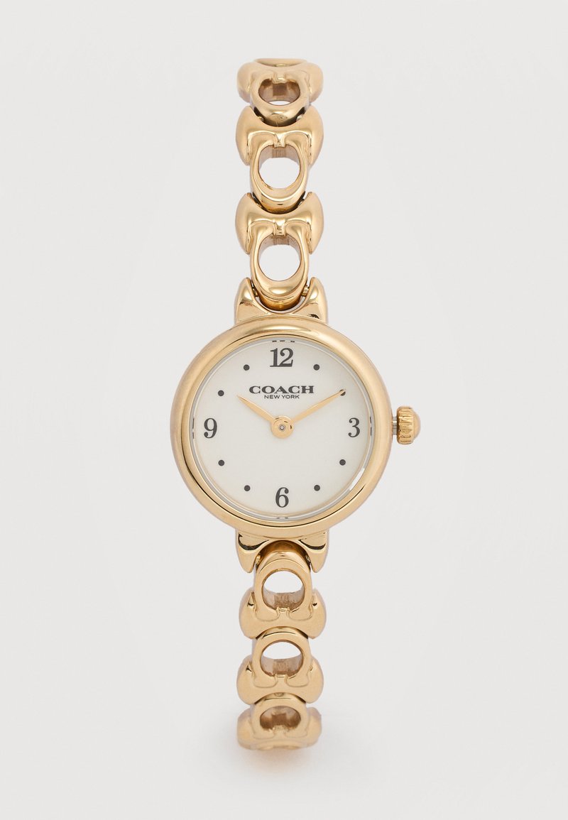 Ρολόι χειρός Coach σε αποχρώσεις χρυσού με λευκό στρογγυλό καντράν, μαύρους αριθμούς στις θέσεις 12, 3, 6, 9 και ρυθμιζόμενο μπρασελέ.