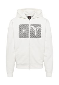 Witte hoodie met rits en een grote grafische afbeelding aan de voorkant met diagonale strepen en gestileerde tekst. Zacht, trui-materiaal.