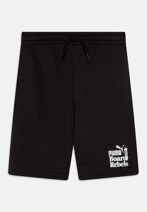 Črne bombažne kratke hlače z elastičnim pasom in nastavljivo vezico. Imajo bel logo "PUMA Board Rebels" na spodnji levi strani.