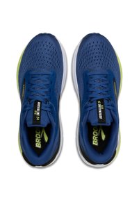 Scarpe da ginnastica blu con tessuto in rete, suole ammortizzate, dettagli neri e loghi e decorazioni verde brillante. Includono lacci e punta rinforzata.