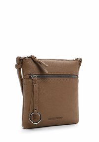 Brown leather crossbody bag with textured surface, silver zipper, and braided strap detail. Features a circular metal accent.