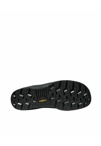 Suola di scarpa nera con un motivo a tassello profondo, con il logo del marchio in giallo. Materiale in gomma testurizzata per durabilità e trazione.