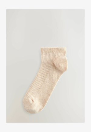 Calzino alla caviglia beige a coste con tallone e punta rinforzati, caratterizzato da una texture morbida e un design classico adatto per l'abbigliamento casual.