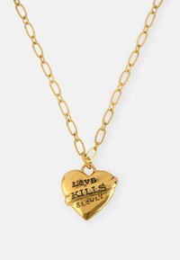 Gold chain necklace with a heart-shaped pendant. Pendant features engraved text: "LOVE KILLS SLOWLY." Chain has oval links.