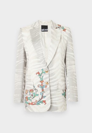 Blazer blanc avec rayures zébrées gris clair, broderie florale colorée sur les poches et l'épaule, deux boutons dorés, étiquette Just Cavalli à l'intérieur.