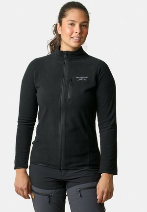 Black fleece jacket with a high collar, zippered front, and a small chest pocket. Features snug cuffs and a soft texture.
