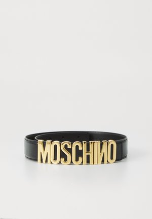 Black leather belt featuring a large, bold golden "MOSCHINO" logo as the buckle, with a smooth texture and classic design.