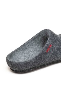 Gray felt slipper with a soft texture, rounded shape, open back, and red embroidered logo on the side. Flat black sole for comfort.